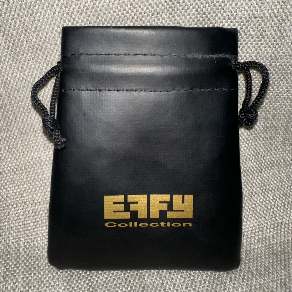 EFFY drawstring, jewelry pouch. Black leatherette Gold lettering.